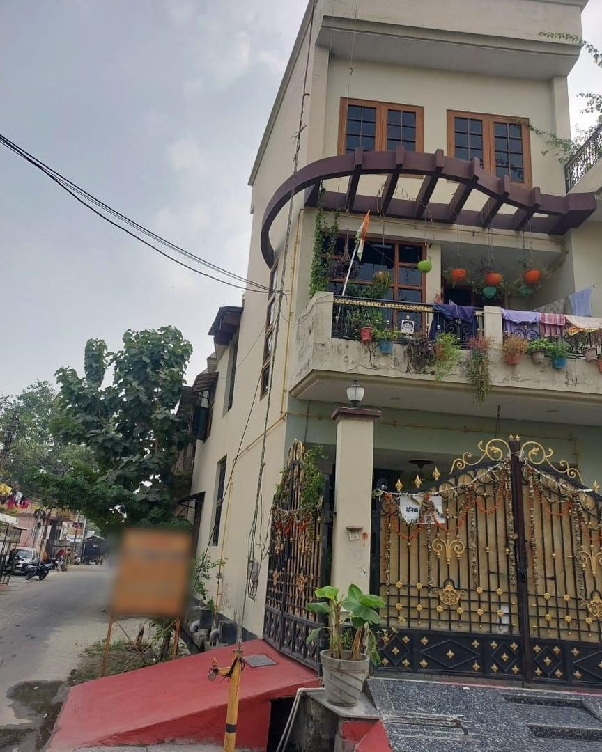 The house before the redesign, seen from the street corner with its side wall