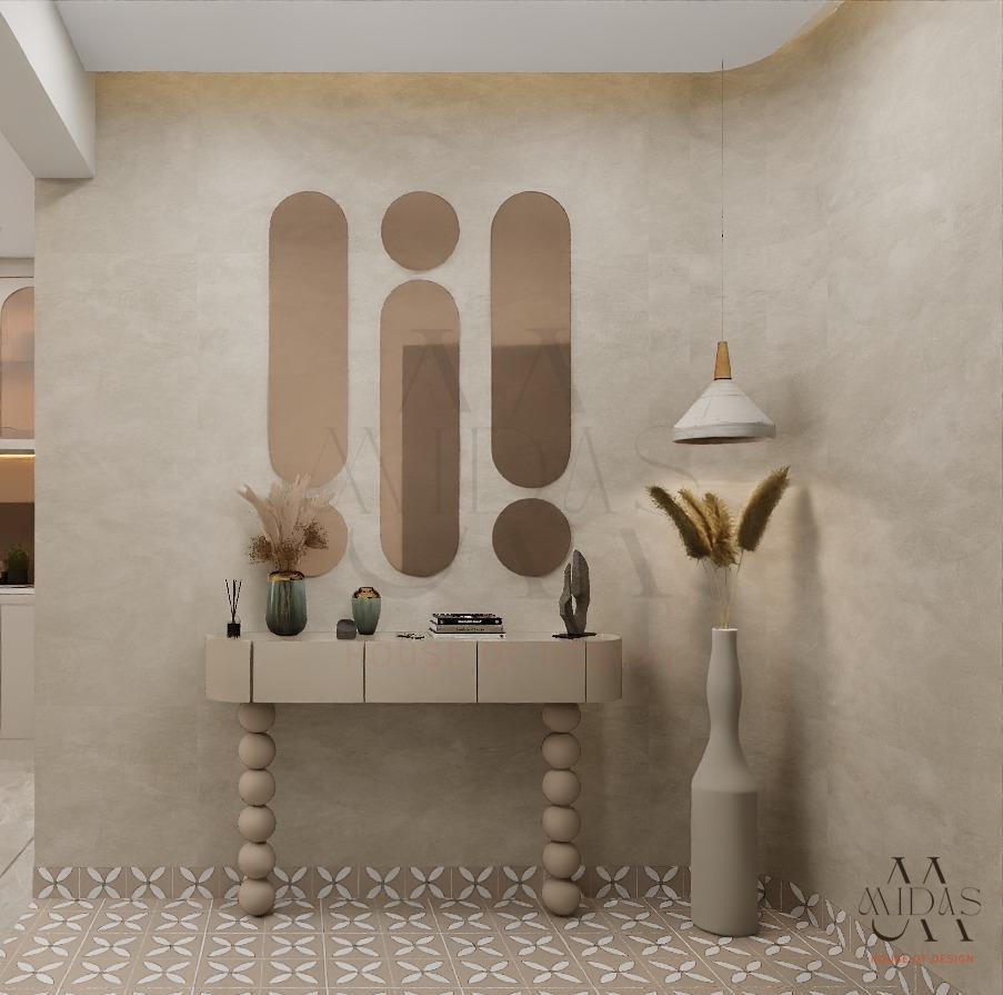 Premium entry foyer with bronze sculptural oval mirrors, bubble-leg console, matte cone pendant, encaustic patterned floor tiles, Bangalore luxury interior